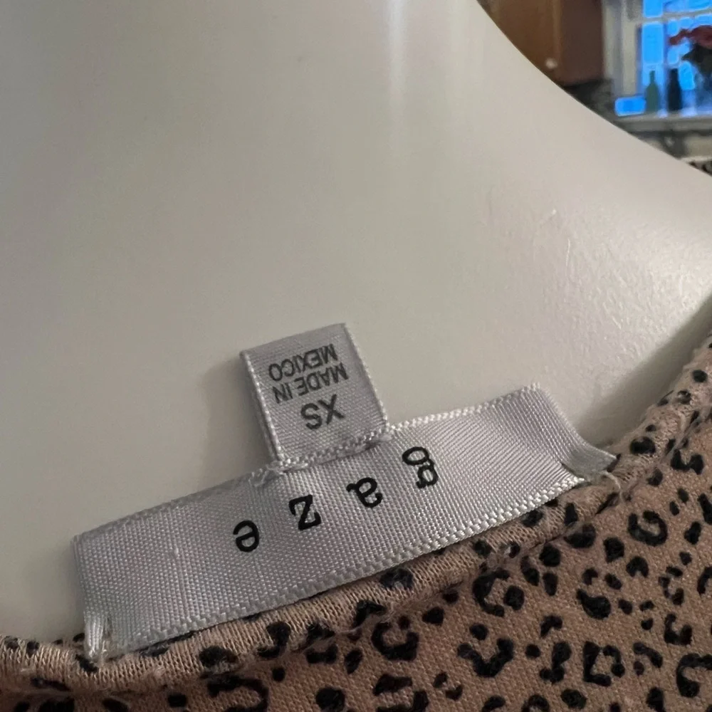 Gaze tan animal cheetah print peplum blouse